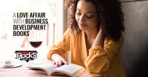 Woman reading business development book.